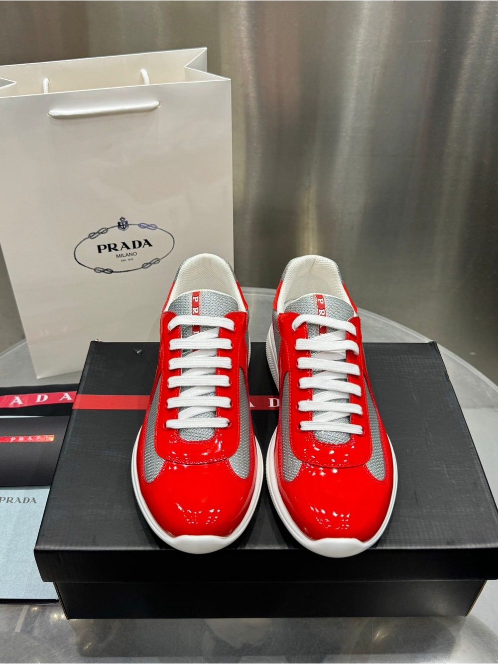 Prada Men’s Red Patent Leather & White Mesh Sneakers